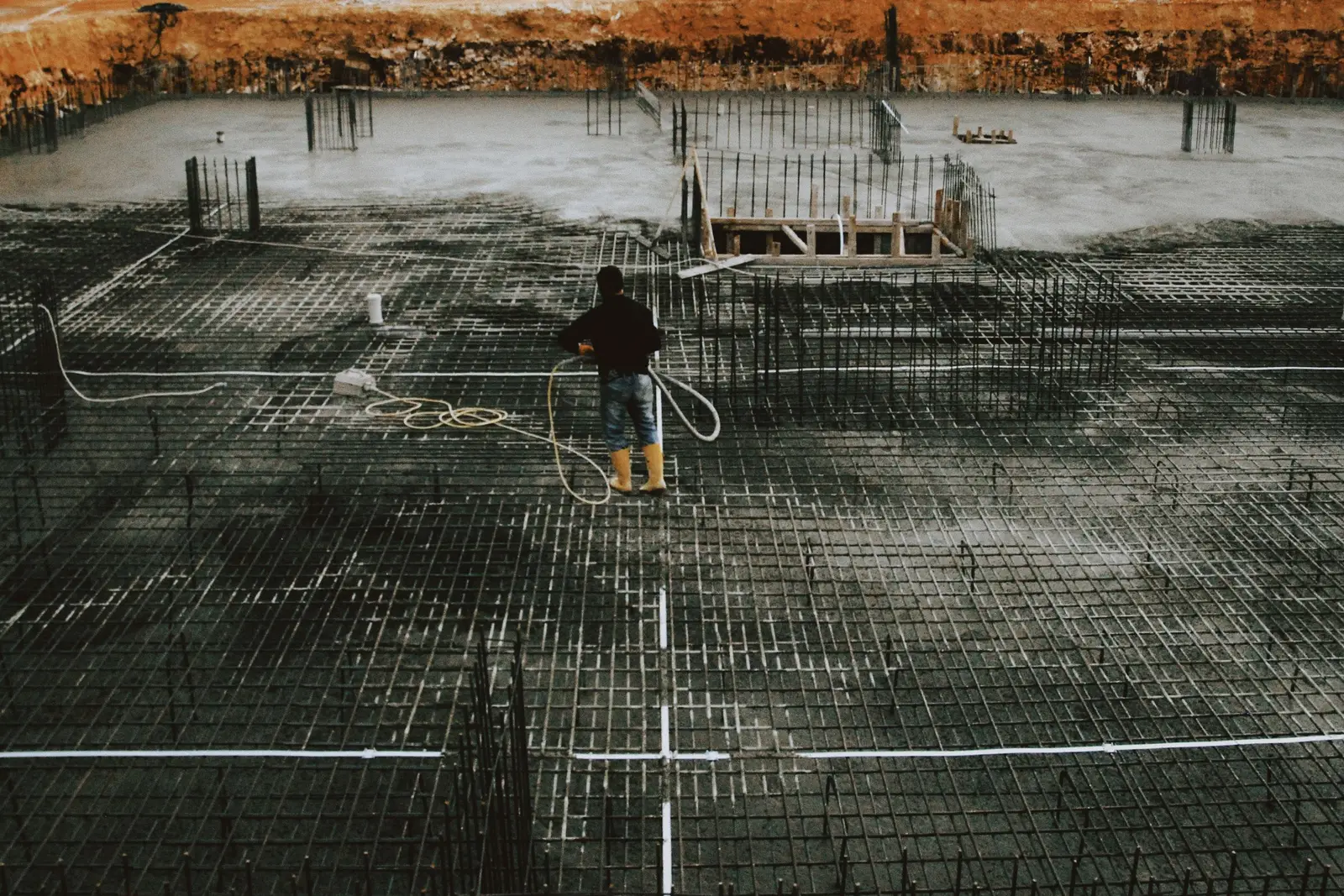 Rebar grid and compacted base set for a concrete slab pour on clay soil in Cedar Hill, TX