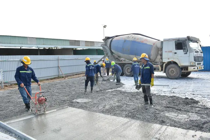 Commercial concrete crew finishing a large parking area slab in Cedar Hill, TX