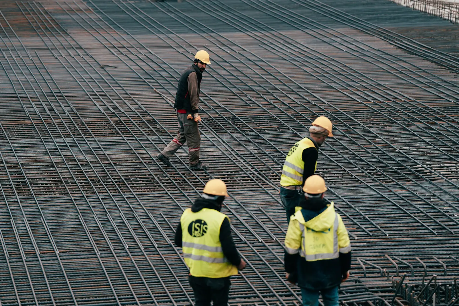 Reinforced concrete foundation slab with rebar grid being poured in Cedar Hill, TX