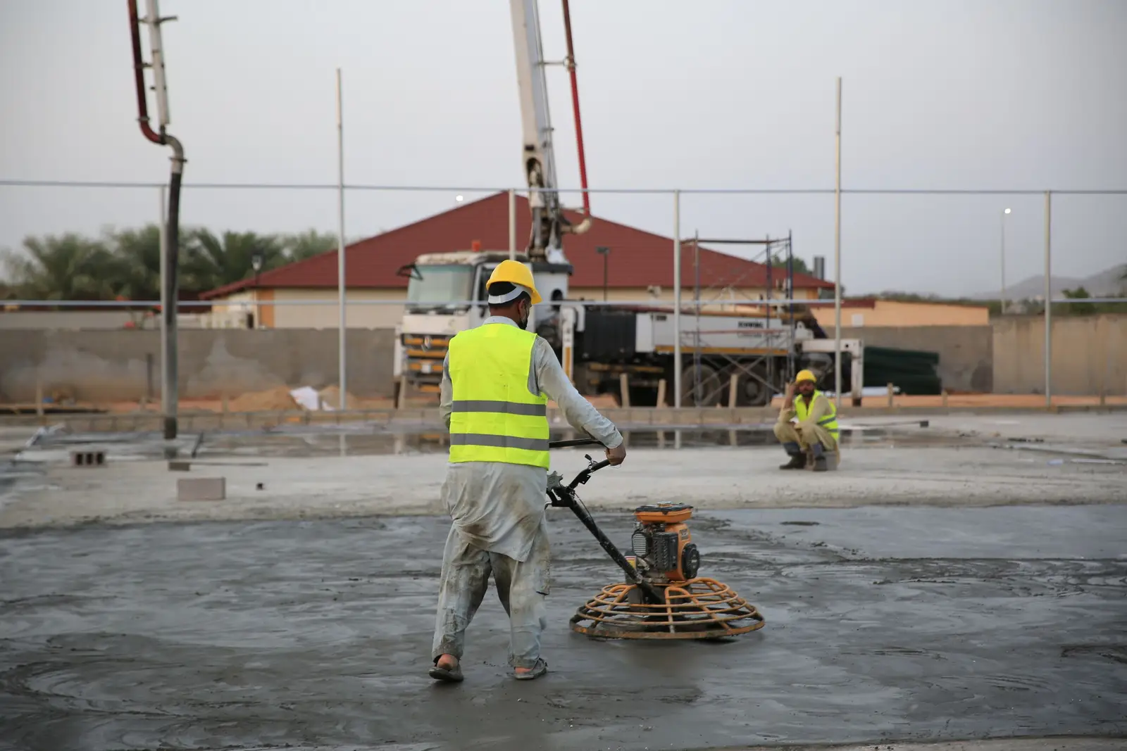 Newly poured concrete parking lot with striped spaces at a commercial building in Cedar Hill, TX
