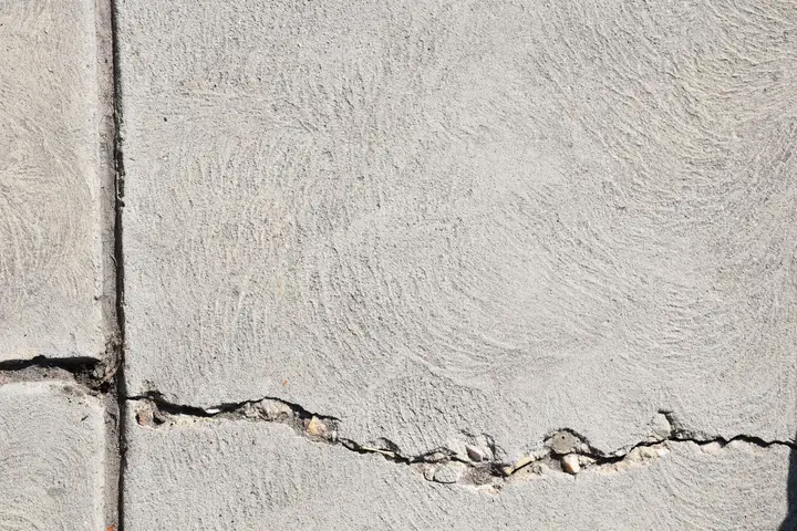 Close-up of concrete crack repair and resurfacing work on a Cedar Hill, TX driveway