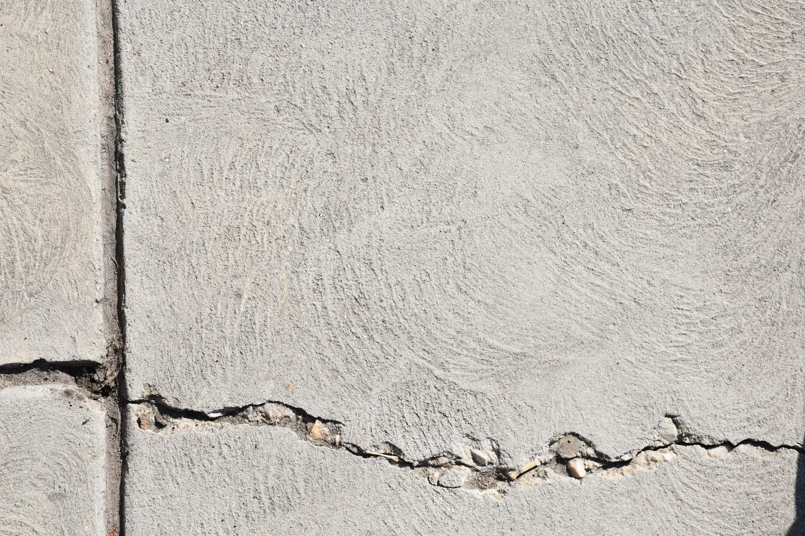 Close-up of concrete crack repair and resurfacing work on a Cedar Hill, TX driveway